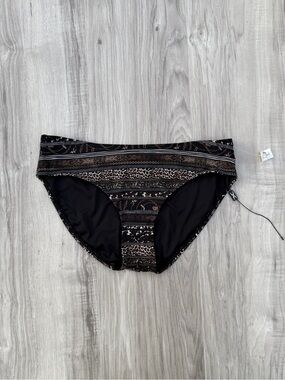 Nip Tuck Swim bikini bottoms feature a multi-patterned design